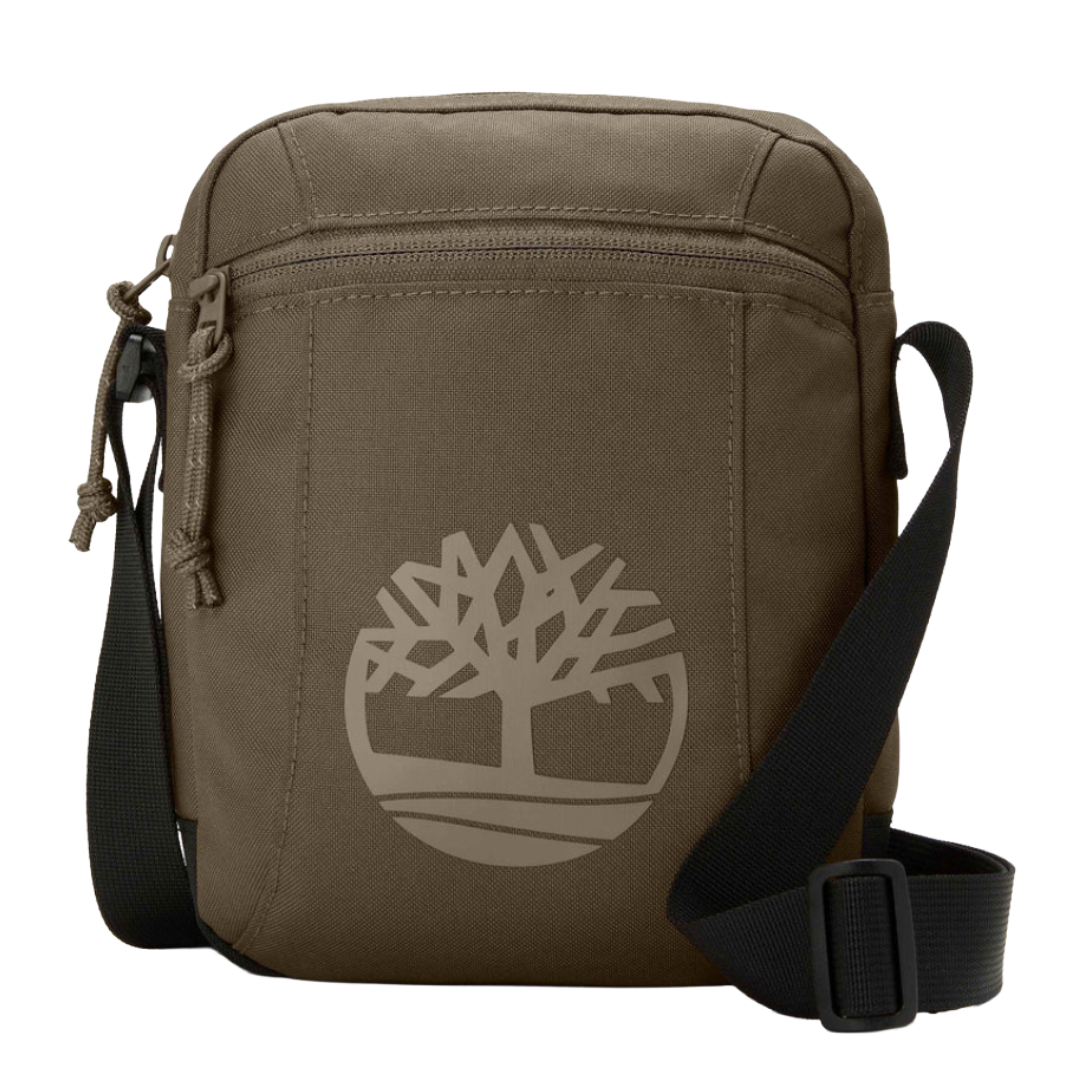 A brown crossbody bag with an adjustable black strap and a front zipper pocket, featuring a tree logo design.