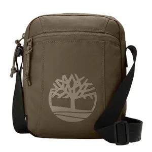 A brown crossbody bag with an adjustable black strap and a front zipper pocket, featuring a tree logo design.