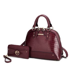 A burgundy crocodile-embossed shoulder bag with gold-tone hardware and a matching wallet with a logo emblem; both items include detachable straps.