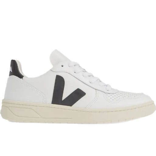 White sneakers with a prominent black \“V\“ logo on the side, featuring a retro low-top design with perforations on the toe box and a cream-colored sole.