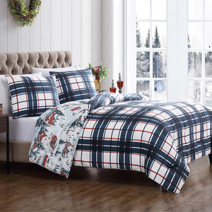 A 3-piece comforter set with a plaid pattern in navy, white, and red. The set includes two matching pillow shams and features a reversible side with a winter holiday scene, adding a festive touch to bedroom decor.