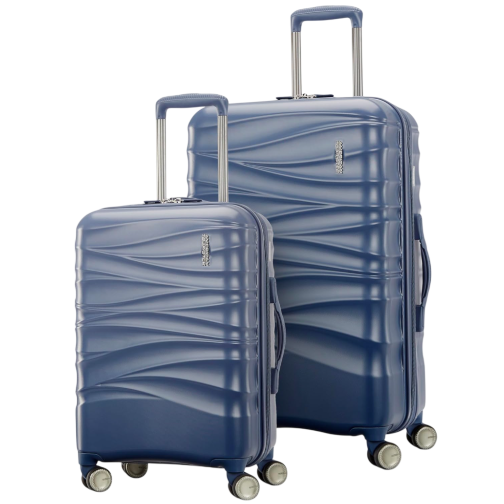 A set of two blue hard-shell suitcases with a textured wave design, featuring adjustable handles and four spinner wheels.