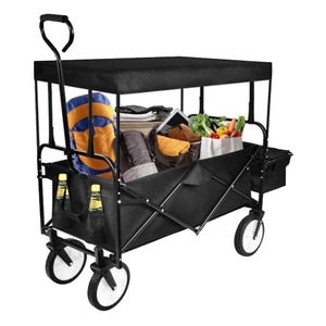 Collapsible wagon with canopy, holding groceries, a rolled blanket, two bottles, and a basketball. Equipped with four wheels and a handle for easy transport.