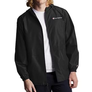 Black Champion windbreaker jacket featuring a hood, full zip closure, elastic cuffs, and the Champion logo on the chest and sleeve.