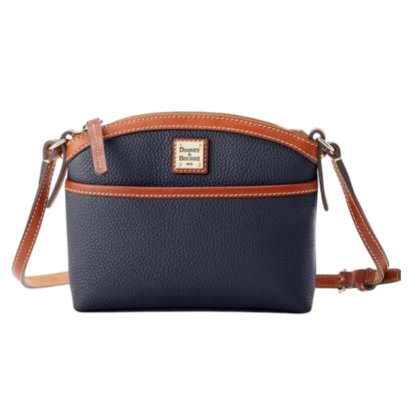 A navy blue crossbody bag with brown leather accents and a Dooney & Bourke logo on the front. It features a zip closure and adjustable strap.