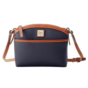 A navy blue crossbody bag with brown leather accents and a Dooney & Bourke logo on the front. It features a zip closure and adjustable strap.