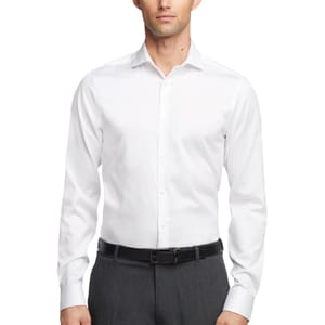 A man is wearing a white, long-sleeve dress shirt paired with gray pants and a black belt.