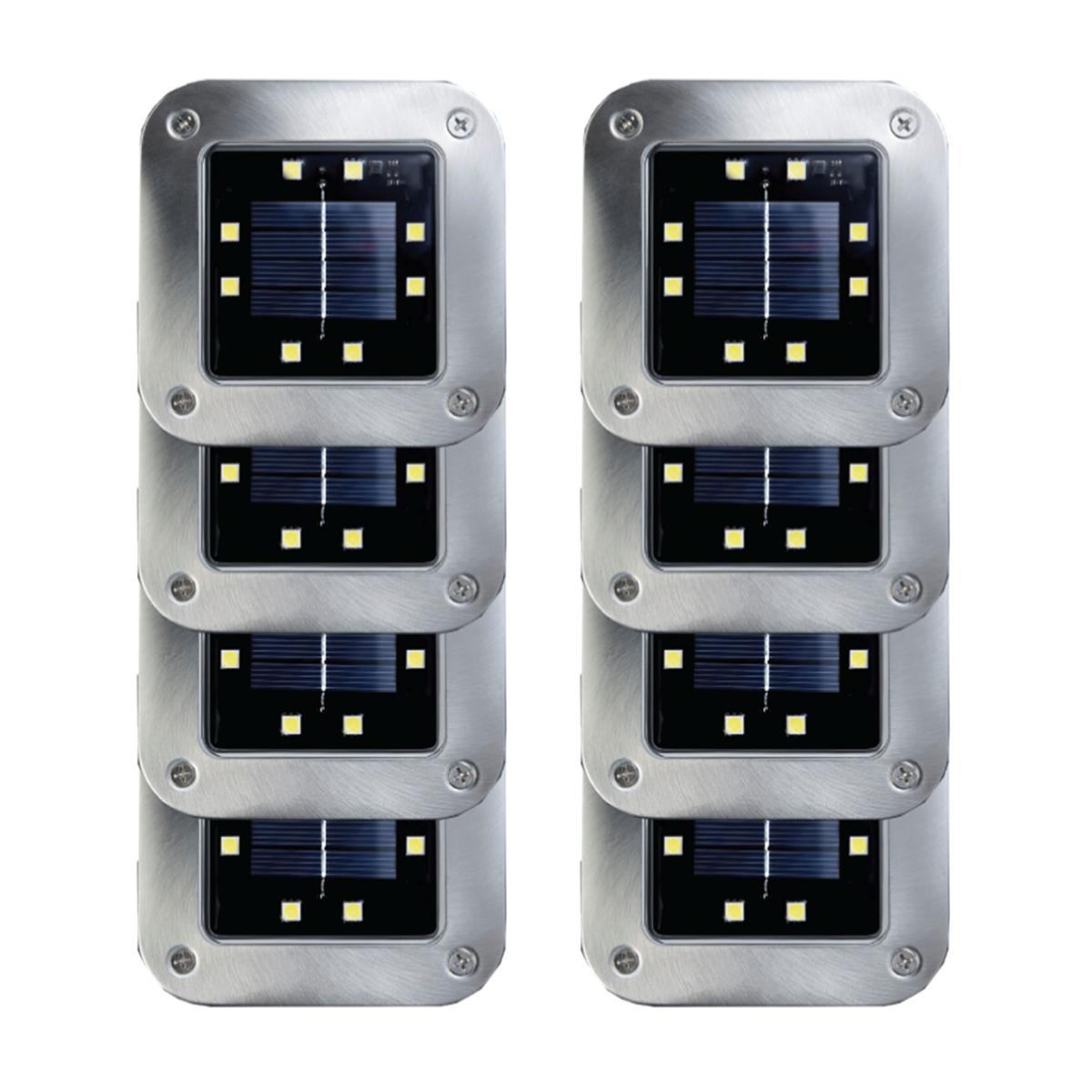 Set of solar-powered square disk lights featuring stainless steel casing, each with a central solar panel surrounded by eight LED lights, designed for outdoor use.