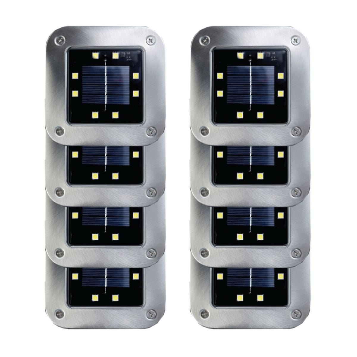 Set of solar-powered square disk lights featuring stainless steel casing, each with a central solar panel surrounded by eight LED lights, designed for outdoor use.