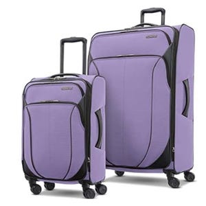 Two purple suitcases with black accents, featuring telescopic handles and four spinner wheels each for easy maneuverability.