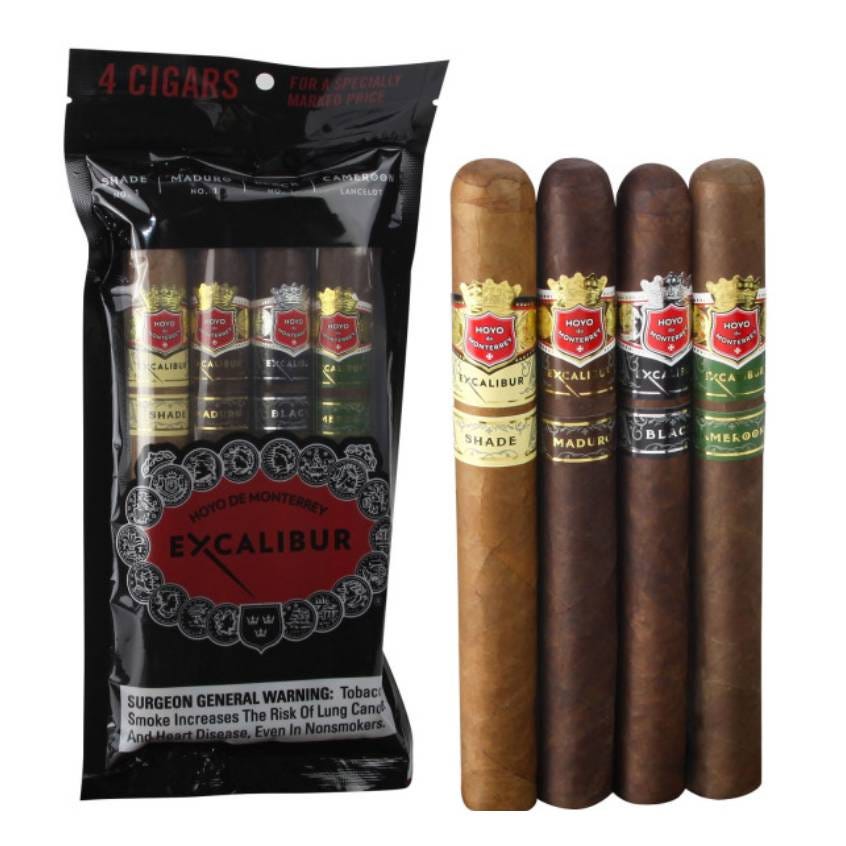 A pack of four Excalibur cigars with various wrappers is displayed, each labeled with the Excalibur brand and housed in a black pouch that warns of tobacco's health risks.