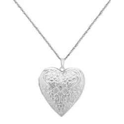 Heart-shaped silver-tone locket with an ornate floral design, hanging from a delicate chain.