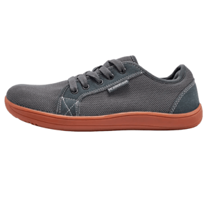 Gray casual sneaker with a dark orange rubber sole and black laces; features a textured fabric upper and a small tab on the side.