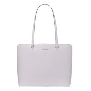 A light lavender tote bag with a minimalist design, featuring long straps and a small rectangular metal accent below the top edge.