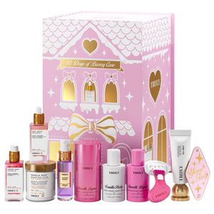 A pink-themed skincare set labeled \“10 Days of Luxury Care\“ includes items like body butters, serums, shaving cream, and a razor from the brand Truly. The packaging features a house design with gold accents.