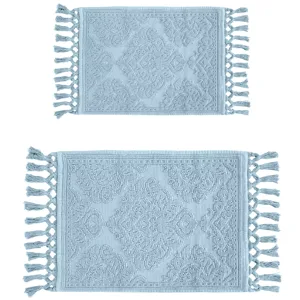 Two light blue, rectangular bath mats with tassel edges and a textured geometric pattern.