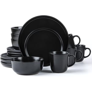 A black dinnerware set includes plates, bowls, and mugs.