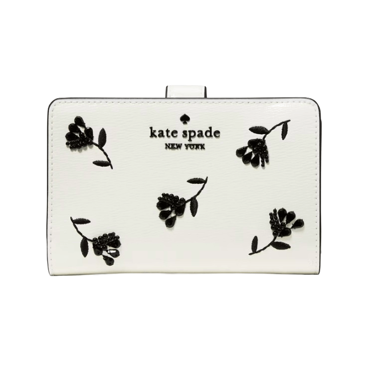 A white Kate Spade New York wallet features black floral embroidery and the brand logo on the front.