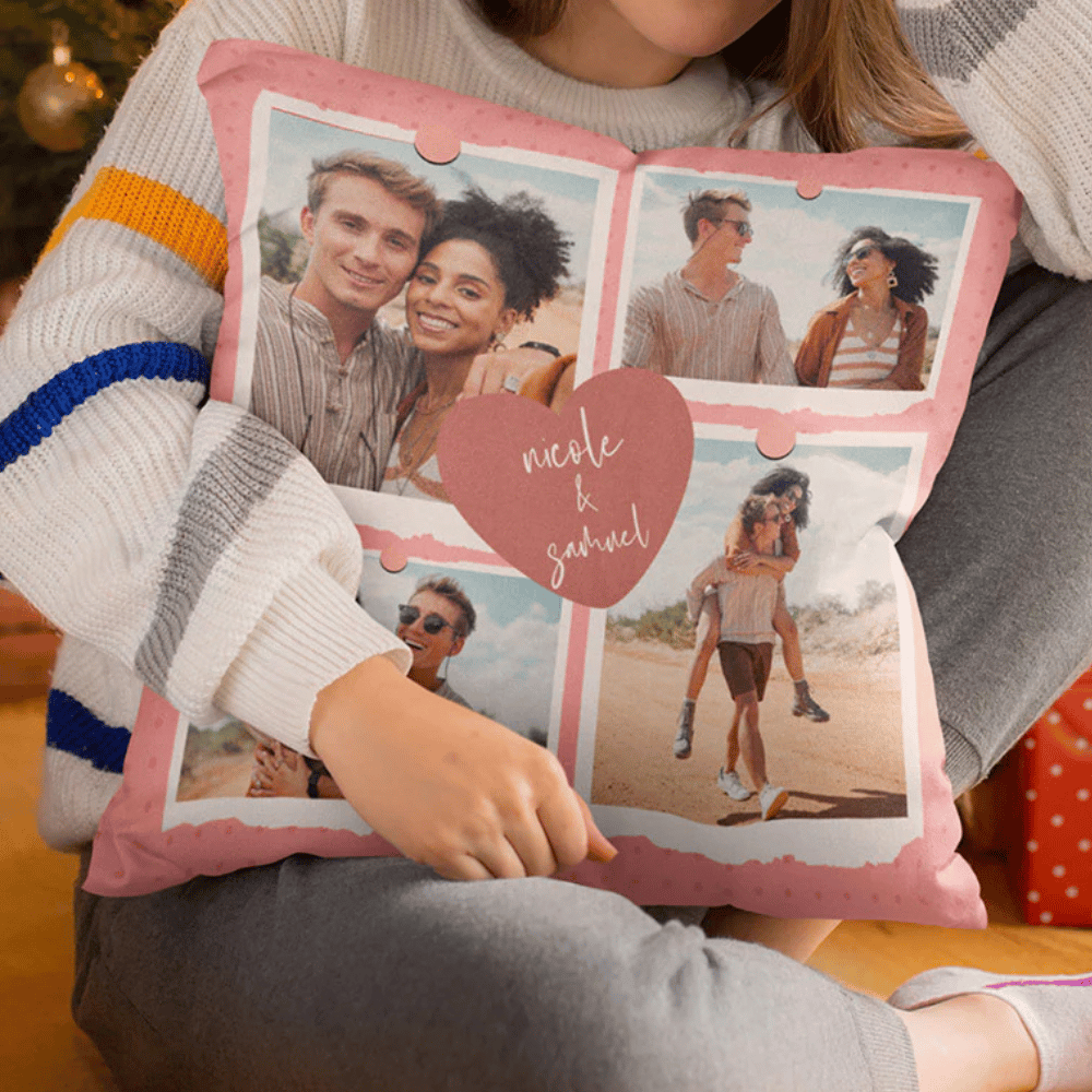 A person holds a decorative pillow with photo collage featuring a couple in different poses and the words \“nicole & samuel\“ in a central heart design.