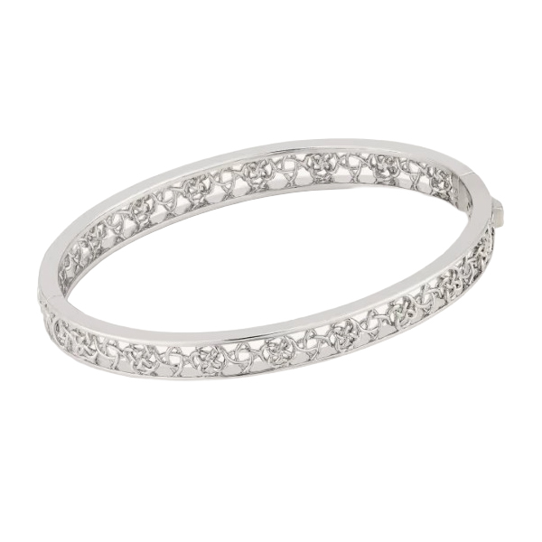 Silver bangle bracelet with an intricate openwork design featuring small floral or star-like patterns around the band.