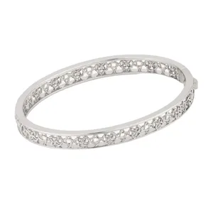 Silver bangle bracelet with an intricate openwork design featuring small floral or star-like patterns around the band.