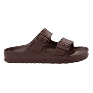 A brown Birkenstock sandal with two adjustable straps and a textured footbed designed for comfort.