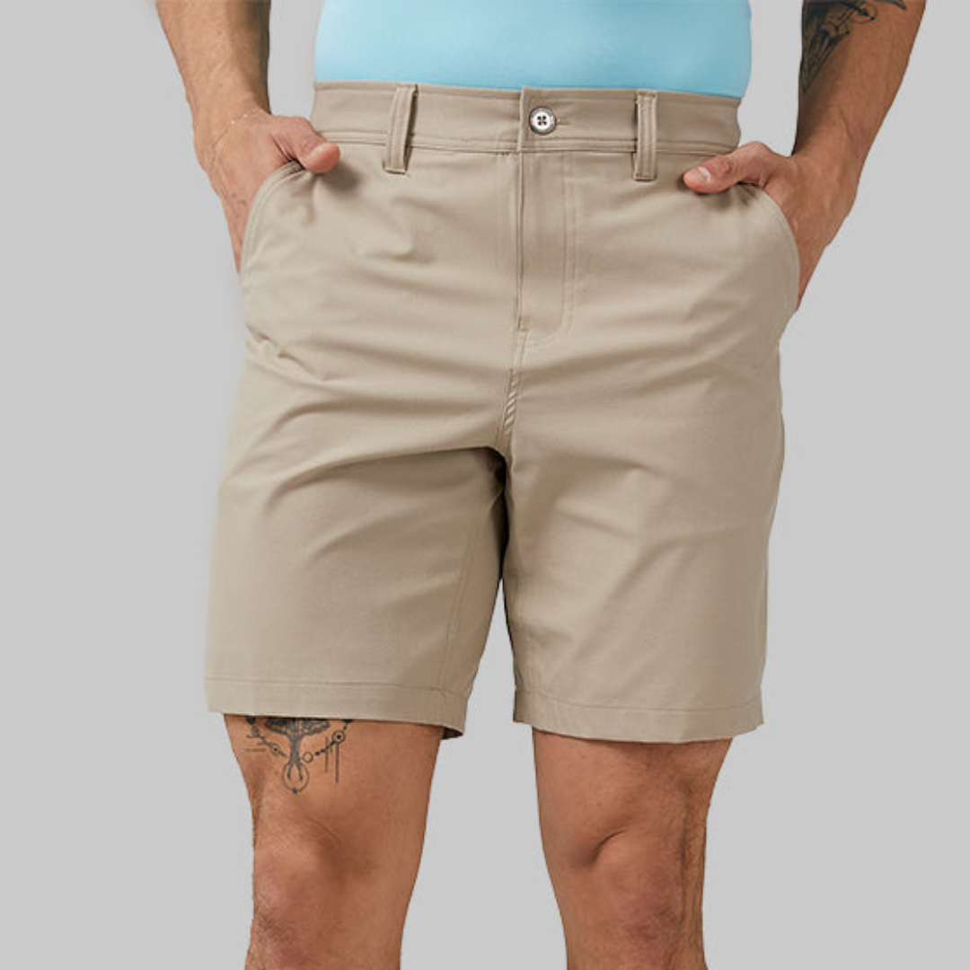 A man wearing khaki shorts.