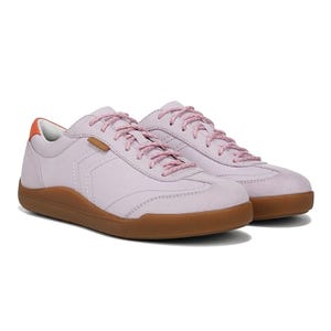 Light purple sneakers with pink laces and brown soles, featuring an orange accent on the heel.