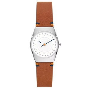 A watch with a silver-toned case and a minimalist white dial features dark blue hands and the text \“Skagen Denmark Solar Powered.\“ The brown leather strap includes blue and orange stitching.