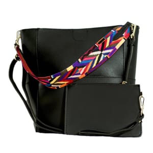 Black handbag with a detachable strap featuring a colorful geometric pattern and an attached small pouch with a zipper closure.