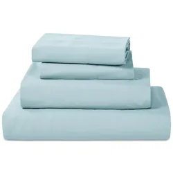 A neatly folded set of light blue bed sheets, including a fitted sheet, flat sheet, and two pillowcases.