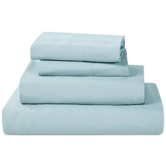 A neatly folded set of light blue bed sheets, including a fitted sheet, flat sheet, and two pillowcases.
