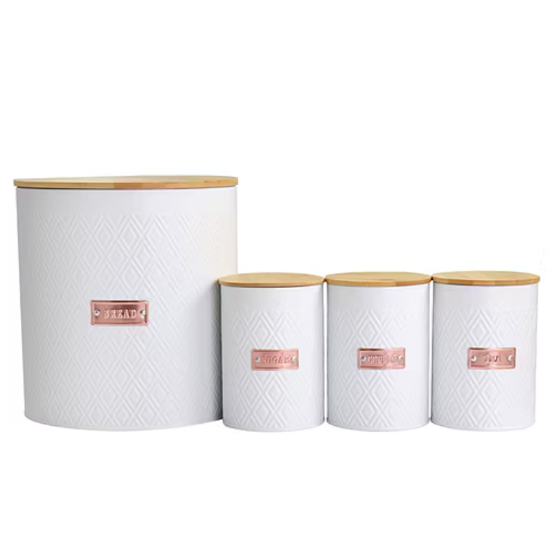 Four white canisters with bamboo lids are labeled for bread, sugar, coffee, and tea. They feature a diamond pattern and copper-colored labels.