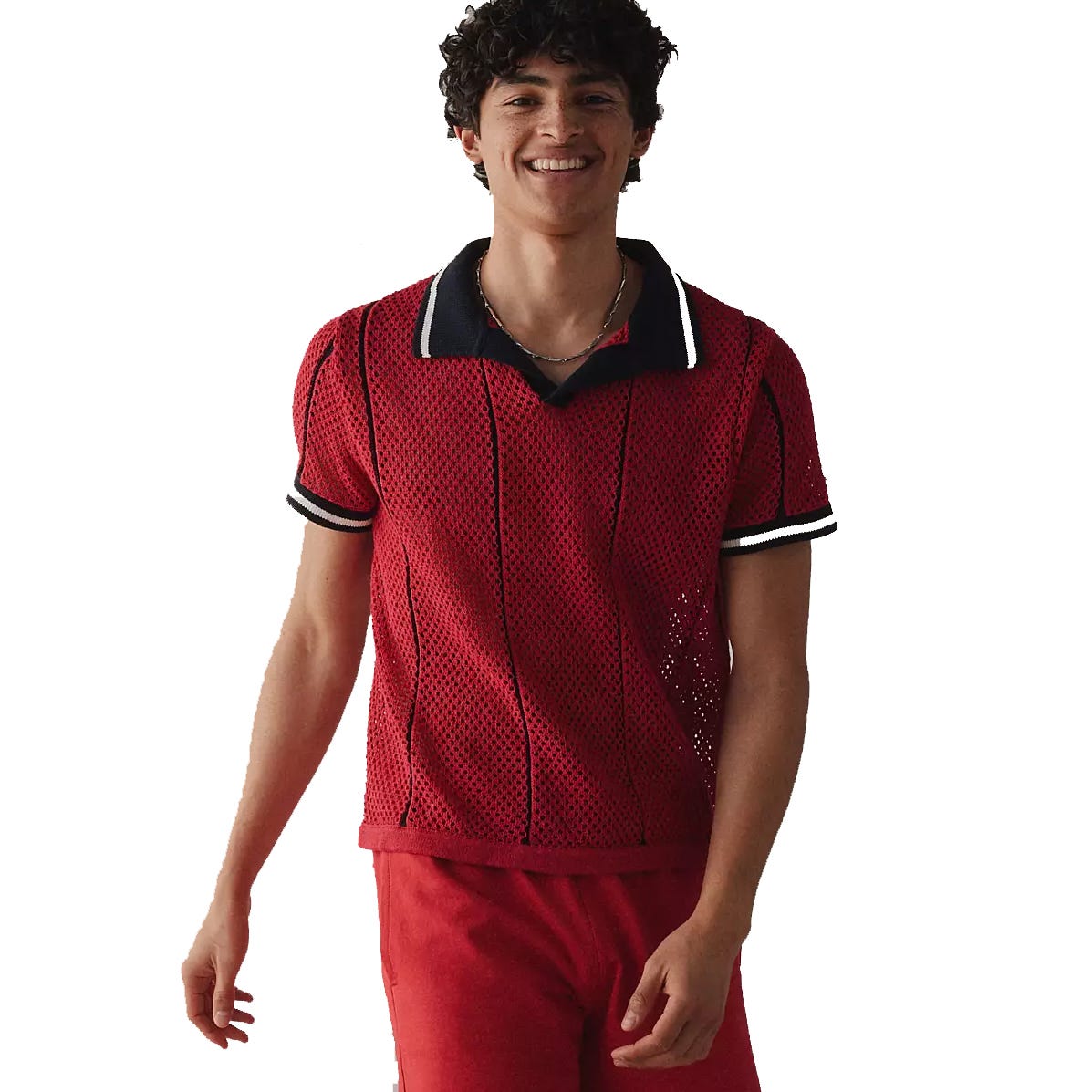 A person is wearing a red mesh polo shirt with black and white trim, paired with red pants.