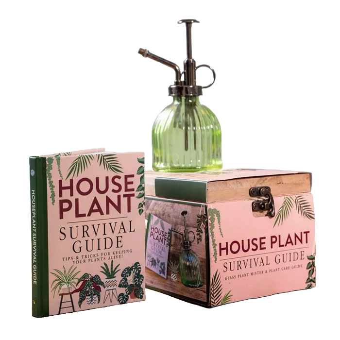 The 3pc Houseplant Survival Set includes a hardcover \“House Plant Survival Guide\“ book, a decorative box, and a green glass plant mister with a metal spray nozzle, all designed to assist in caring for houseplants.