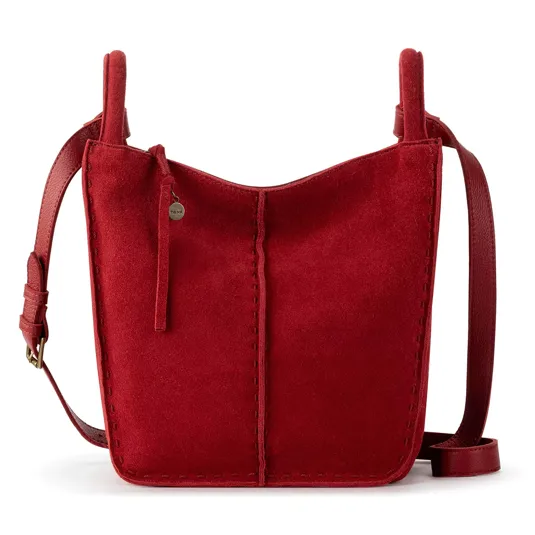 A red suede shoulder bag with a simple design, featuring vertical stitching and an adjustable strap.