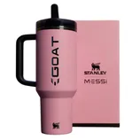 A pink Stanley tumbler with \“GOAT\“ and \“Messi\“ branding is displayed alongside a matching pink box.