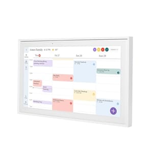 A digital wall-mounted family organizer display showing a calendar with scheduled events and weather updates.