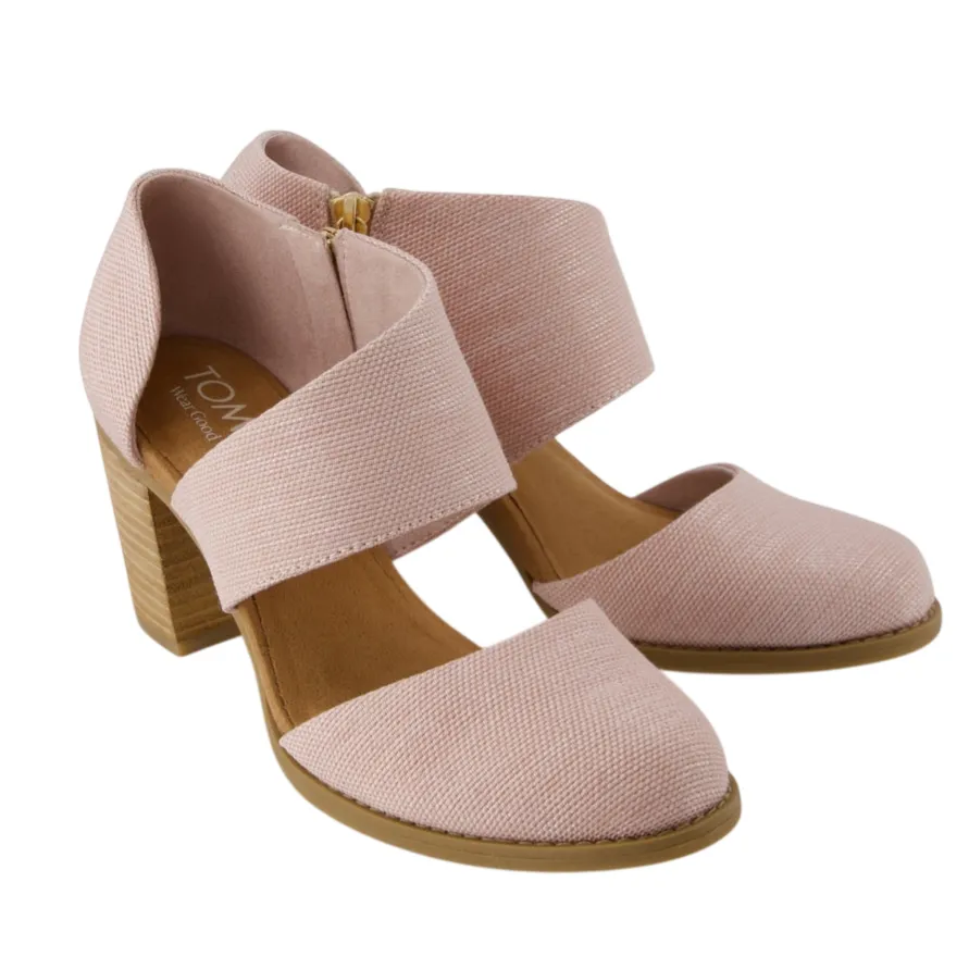 Pink women's heeled shoes with wide straps, closed toe, and wooden block heels.