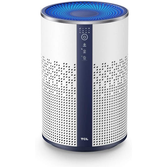 A TCL air purifier with a cylindrical design featuring perforated sides, a blue-lit top, and control buttons on the front.