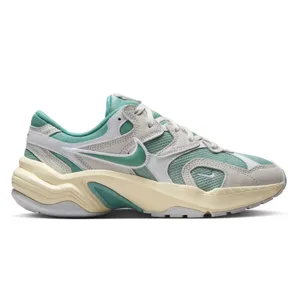 Nike sneakers with a retro design feature teal and beige colors, showcasing a wavy midsole and mesh accents for breathability.