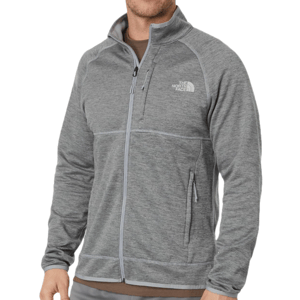 The North Face Canyonlands Jacket is a gray, full-zip fleece with a high collar, featuring a chest zip pocket and two side pockets. The logo is displayed on the left chest.