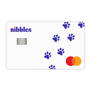 A white Nibbles credit card features blue paw prints and a Mastercard logo, with a silver chip on the left side.