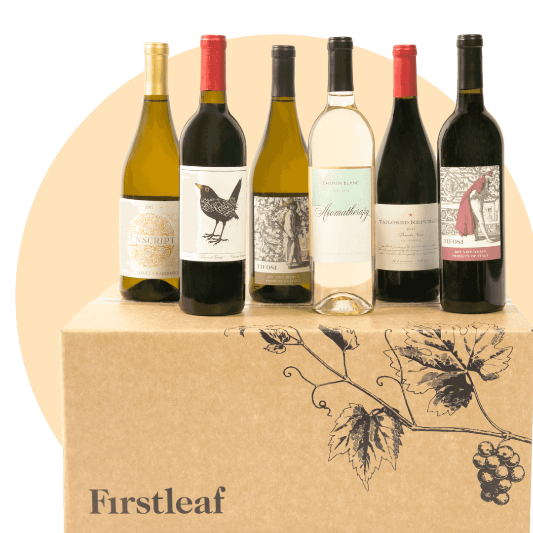 A selection of six wine bottles, including Chardonnay and Chenin Blanc, displayed on a Firstleaf wine subscription box with a grapevine illustration.