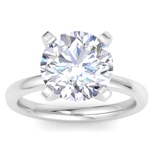 A round brilliant 5-carat lab-grown diamond ring set in a four-prong platinum band, featuring a highly reflective and clear gemstone with a classic solitaire design.