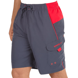 Gray swim trunks with red accents, featuring a drawstring waist, side pockets, and a cargo pocket with a flap and eyelets. \“Speedo\“ is embroidered on the cargo pocket flap.