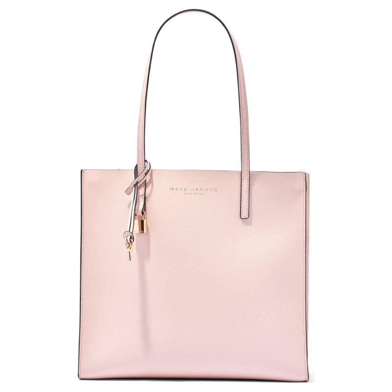 A light pink tote bag with a structured design, featuring two handles, a gold-tone lock charm, and \“MARC JACOBS NEW YORK\“ embossed on the front.