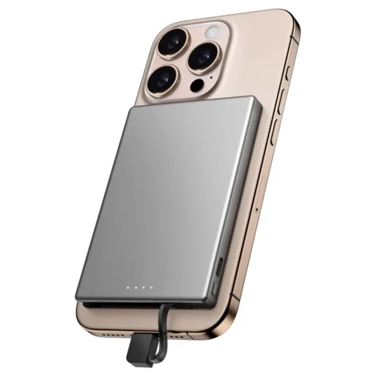 A smartphone with a triple-lens camera has a slim, rectangular power bank attached to its back. An attached cable connects the power bank to the device's charging port.