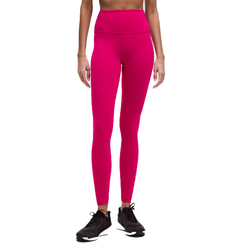 Bright pink high-waisted leggings paired with black sneakers.