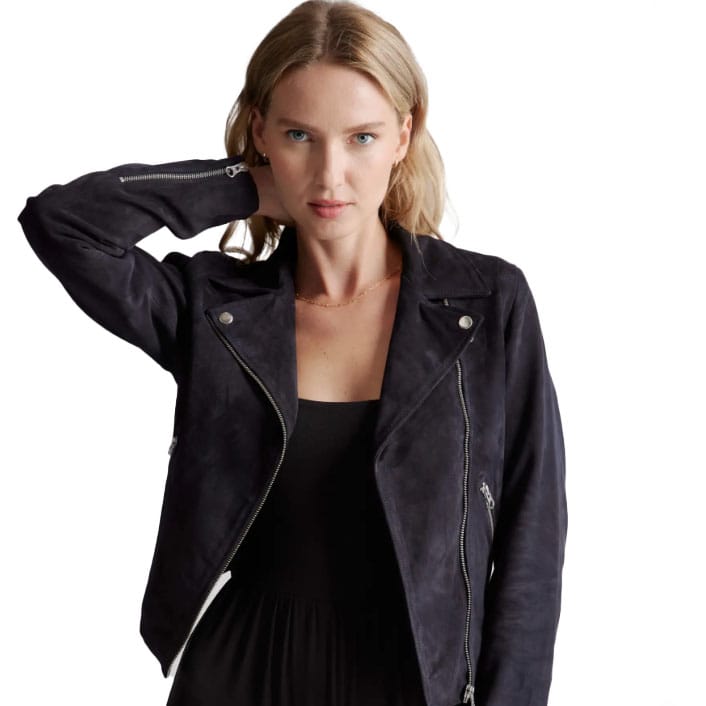A woman is wearing a black suede biker jacket with asymmetrical zip closure and notched lapels.